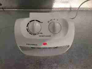 INKBIRD heater control panel with temperature settings and indicator light for temperature management in cooler systems.