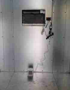 CoolBot installed in a walk-in cooler, showcasing the temperature control system for effective winter management.
